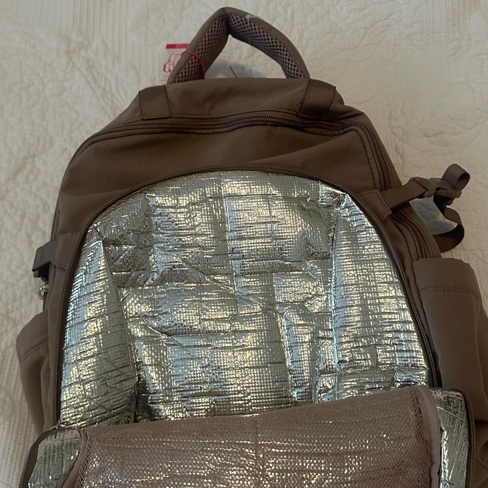 Viral Isaac Mizrahi cooler backpack, holds a 40 oz tumbler on side ,Plum color